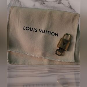 Louis Vuitton Gold Padlock #311 With Dust Bag.